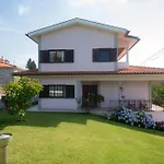 Em *